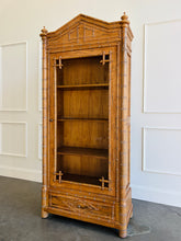 Load image into Gallery viewer, The Dunehaven Bamboo Bookcase turns treasured books and collected objects into a beautifully composed display. Its tall, narrow silhouette provides generous vertical storage without requiring a large footprint, making it especially useful in living rooms, libraries, dining rooms, or home offices. Crafted from mahogany solids with mango wood veneers, the cabinet’s Beachwood finish highlights the natural grain and warmth of the wood. Good Bones Furniture
