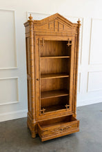 Load image into Gallery viewer, The Dunehaven Bamboo Bookcase turns treasured books and collected objects into a beautifully composed display. Its tall, narrow silhouette provides generous vertical storage without requiring a large footprint, making it especially useful in living rooms, libraries, dining rooms, or home offices. Crafted from mahogany solids with mango wood veneers, the cabinet’s Beachwood finish highlights the natural grain and warmth of the wood. Good Bones Furniture
