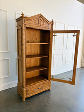 Load image into Gallery viewer, The Dunehaven Bamboo Bookcase turns treasured books and collected objects into a beautifully composed display. Its tall, narrow silhouette provides generous vertical storage without requiring a large footprint, making it especially useful in living rooms, libraries, dining rooms, or home offices. Crafted from mahogany solids with mango wood veneers, the cabinet’s Beachwood finish highlights the natural grain and warmth of the wood. Good Bones Furniture
