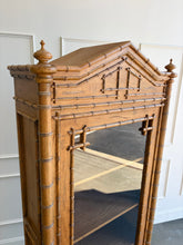 Load image into Gallery viewer, The Dunehaven Bamboo Bookcase turns treasured books and collected objects into a beautifully composed display. Its tall, narrow silhouette provides generous vertical storage without requiring a large footprint, making it especially useful in living rooms, libraries, dining rooms, or home offices. Crafted from mahogany solids with mango wood veneers, the cabinet’s Beachwood finish highlights the natural grain and warmth of the wood. Good Bones Furniture
