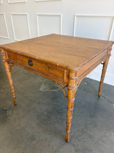 Load image into Gallery viewer, The Dunehaven Bamboo Game Table creates an inviting spot for cards, Mahjong, or an intimate conversation, with a square top that brings everyone within easy reach. Bamboo-inspired trim, turned legs, and curved stretcher details give it the collected character of a timeless favorite. Good Bones Furniture
