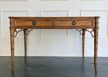Load image into Gallery viewer, The new Dunehaven Bamboo Writing Desk brings the warmth and character of classic bamboo-inspired design to your home office, bedroom, or favorite writing corner. Its gently rounded trim, turned legs, and rich wood grain give the piece a collected, timeless feel, while two drawers keep papers and everyday essentials close at hand. Good Bones Furniture
