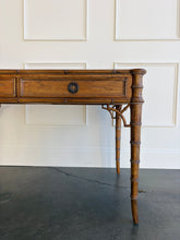Load image into Gallery viewer, The new Dunehaven Bamboo Writing Desk brings the warmth and character of classic bamboo-inspired design to your home office, bedroom, or favorite writing corner. Its gently rounded trim, turned legs, and rich wood grain give the piece a collected, timeless feel, while two drawers keep papers and everyday essentials close at hand. Good Bones Furniture
