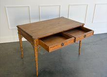 Load image into Gallery viewer, The new Dunehaven Bamboo Writing Desk brings the warmth and character of classic bamboo-inspired design to your home office, bedroom, or favorite writing corner. Its gently rounded trim, turned legs, and rich wood grain give the piece a collected, timeless feel, while two drawers keep papers and everyday essentials close at hand. Good Bones Furniture

