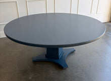 Load image into Gallery viewer, Inspired by Mid-Century design, the Maxwell Round Dining Table pairs clean architectural lines with softened curves for a look that feels modern yet timeless. Crafted from hand-selected oak solids and veneers, its generous 72-inch round top is supported by a substantial pedestal base with four gracefully curved feet. The table has been professionally lacquered by Good Bones Furniture in Farrow &amp; Ball Hague Blue.

