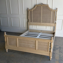Load image into Gallery viewer, The Frontgate Beauvier French Cane Bed brings timeless Louis XVI style to the bedroom with elegant straight lines, classical ornament, and warm natural texture. Crafted from solid mahogany, it features handwoven double cane panels, twisted ribbon carving, floral swag and laurel wreath detailing, and beaded accents along the rails and finials. Good Bones Furniture
