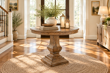 Load image into Gallery viewer, Bring the essence of the Italian countryside into your home with the Pastry Table with Tuscan Style Base. This beautifully designed piece features a solid mango wood construction that’s built to last, paired with a classic Tuscan-inspired pedestal base. The Beachwood finish brings out the natural beauty of the wood, with light, warm tones that add a touch of elegance to any setting. Good Bones Furniture
