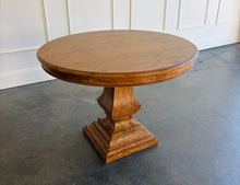 Load image into Gallery viewer, Bring the essence of the Italian countryside into your home with the Pastry Table with Tuscan Style Base. This beautifully designed piece features a solid mango wood construction that’s built to last, paired with a classic Tuscan-inspired pedestal base. The Beachwood finish brings out the natural beauty of the wood, with light, warm tones that add a touch of elegance to any setting. Good Bones Furniture
