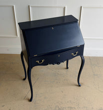 Load image into Gallery viewer, This vintage secretary desk has been professionally lacquered in Sherwin Williams Naval, giving the classic silhouette a rich, dramatic presence while preserving its traditional detailing and graceful cabriole legs. The drop-front desk opens to reveal a warm mahogany interior with divided compartments. Good Bones Furniture
