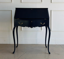 Load image into Gallery viewer, This vintage secretary desk has been professionally lacquered in Sherwin Williams Naval, giving the classic silhouette a rich, dramatic presence while preserving its traditional detailing and graceful cabriole legs. The drop-front desk opens to reveal a warm mahogany interior with divided compartments. Good Bones Furniture
