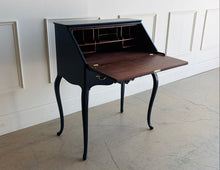 Load image into Gallery viewer, This vintage secretary desk has been professionally lacquered in Sherwin Williams Naval, giving the classic silhouette a rich, dramatic presence while preserving its traditional detailing and graceful cabriole legs. The drop-front desk opens to reveal a warm mahogany interior with divided compartments. Good Bones Furniture
