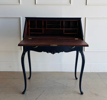Load image into Gallery viewer, This vintage secretary desk has been professionally lacquered in Sherwin Williams Naval, giving the classic silhouette a rich, dramatic presence while preserving its traditional detailing and graceful cabriole legs. The drop-front desk opens to reveal a warm mahogany interior with divided compartments. Good Bones Furniture
