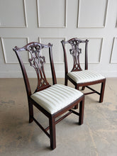 Load image into Gallery viewer, Classic craftsmanship never goes out of style. This exceptional set of eight Henredon Chippendale dining chairs showcases the artistry and quality that made Henredon one of America's premier furniture makers. Crafted from richly finished mahogany, each chair features an intricately carved pierced splat back inspired by 18th-century Chippendale designs, accented with elegant detailing and crisp architectural lines. Good Bones Furniture
