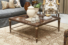 Load image into Gallery viewer, The Hickory White Carmen Cocktail Table is a showroom sample in very good condition, reflecting careful display use rather than residential wear. The surface retains its rich clarity and depth, with the crotch walnut veneer pattern remaining crisp and beautifully defined.&nbsp;
