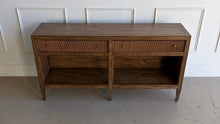 Load image into Gallery viewer, The Hickory White Tulia Console combines tailored craftsmanship with warm natural character. Finished in the rich Autumn finish, the wood grain is beautifully highlighted across the top and case, giving the piece a relaxed but refined presence. The design features two fluted-front drawers with small brass knobs, paired with open shelving below for additional storage or display. Good Bones Furniture
