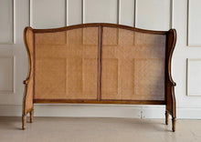 Load image into Gallery viewer, The Kingstone Cane Headboard brings the perfect blend of natural beauty and refined elegance to your bedroom. Constructed with a solid mango wood frame and detailed with stunning cane along the back and sides, this headboard exudes craftsmanship and style. Its clean lines and rich textures make it an ideal choice for both modern and traditional interiors. Good Bones Furniture
