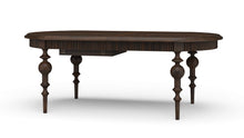 Load image into Gallery viewer, Butterfly oval extension dining table in Dark Walnut mahogany shown closed, featuring sculpted apron and turned legs, Kraton dining table by Good Bones Furniture in Raleigh, NC
