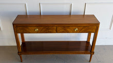 Load image into Gallery viewer, The Lipton 2 Drawer Console Table is a study in balance—combining classical detailing with a clean, tailored silhouette. Fluted legs, subtle carved accents, and a lower display shelf give the piece a refined, architectural presence, while the overall proportions keep it light and versatile. The drawer fronts are wrapped in richly figured cerejeira veneer. Good Bones Furniture
