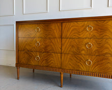 Load image into Gallery viewer, The Lipton Six Drawer Dresser blends neoclassical restraint with the warmth and refinement of early-20th-century European cabinetry. Its silhouette is grounded and architectural, yet softened by subtle curves, tapered legs, and a finely scaled apron—details that keep the piece feeling elegant rather than formal. Good Bones Furniture
