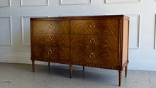 Load image into Gallery viewer, The Lipton Six Drawer Dresser blends neoclassical restraint with the warmth and refinement of early-20th-century European cabinetry. Its silhouette is grounded and architectural, yet softened by subtle curves, tapered legs, and a finely scaled apron—details that keep the piece feeling elegant rather than formal. Good Bones Furniture
