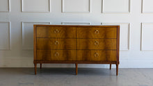 Load image into Gallery viewer, The Lipton Six Drawer Dresser blends neoclassical restraint with the warmth and refinement of early-20th-century European cabinetry. Its silhouette is grounded and architectural, yet softened by subtle curves, tapered legs, and a finely scaled apron—details that keep the piece feeling elegant rather than formal. Good Bones Furniture
