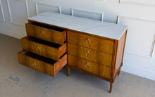 Load image into Gallery viewer, The Lipton Six Drawer Dresser blends neoclassical restraint with the warmth and refinement of early-20th-century European cabinetry. Its silhouette is grounded and architectural, yet softened by subtle curves, tapered legs, and a finely scaled apron—details that keep the piece feeling elegant rather than formal. Good Bones Furniture
