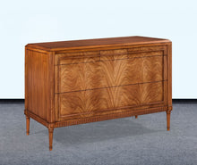 Load image into Gallery viewer, The Lipton Accent Chest is an exquisite blend of classic design and modern luxury. Crafted from mahogany solids with cerejeira and mahogany veneers, this piece showcases a stunning, highly figured grain pattern framed by elegant fluted corner details. The smooth white marble top or luxurious mahogany top adds a timeless sophistication and practical durability, making this chest as functional as it is beautiful. Good Bones Furniture
