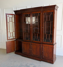 Load image into Gallery viewer, This Georgian-style breakfront china cabinet by Maitland Smith showcases the impeccable construction and richly figured mahogany the maker is known for. The upper cabinet features an illuminated interior behind glass-paneled doors, with adjustable glass shelves that beautifully display china, books, or collected objects. The top is made in three separate sections for easier transport and installation. Good Bones Furniture
