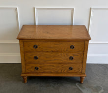 Load image into Gallery viewer, The Milano Large Nightstand is a harmonious blend of thoughtful craftsmanship and versatile style. Handcrafted from solid mahogany and burled ash veneer, it offers three roomy drawers fitted with smooth, self closing glides for effortless access to your evening essentials. Solid brass hardware punctuates the design. Good Bones Furniture
