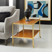 Load image into Gallery viewer, The Modern History George Side Table pairs classic proportions with refined materials, creating a versatile accent piece for living spaces. The rectangular form features a beautifully figured movingue veneer top and lower shelf, framed by warm brass detailing that highlights the natural character of the wood. Good Bones Furniture

