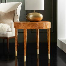 Load image into Gallery viewer, The Modern History Salena Round End Table brings together sculptural simplicity and the rich visual drama of burl wood. Its clean circular silhouette highlights the striking natural patterns of burl veneer, creating a piece that feels both refined and organic. Olive Ash Burl veneer. Good Bones Furniture
