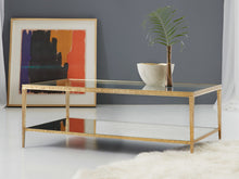 Load image into Gallery viewer, The Modern History Sculpture Cocktail Table brings striking texture and clean architectural lines to the center of a living space. Crafted with a hammered antique brass finish, the rectangular frame has a sculptural presence that feels both modern and timeless. Good Bones Furniture
