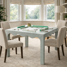 Load image into Gallery viewer, The Naomi Game Table by Hooker Furniture brings playful sophistication to gathering spaces with its distinctive texture and tailored design. Fully wrapped in hand-finished coastal blue painted raffia, it offers a rich, tactile surface that adds depth and visual interest. Good Bones Furniture
