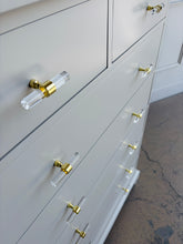 Load image into Gallery viewer, This Newport Cabinet Company chest has been professionally lacquered in Benjamin Moore Natural Cream for a bright, elegant finish that highlights its timeless design. Seven deep drawers provide generous vertical storage. Good Bones Furniture
