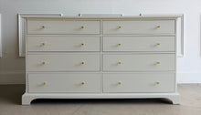 Load image into Gallery viewer, A timeless Newport Cabinet Company dresser professionally refinished in Benjamin Moore Natural Cream, creating a fresh, sophisticated look while preserving its exceptional craftsmanship. Featuring eight generously sized drawers, this dresser offers abundant storage with clean, tailored lines that complement both traditional and transitional interiors. Good Bones Furniture
