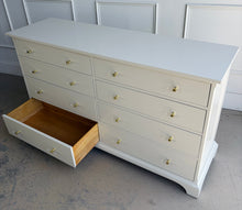 Load image into Gallery viewer, A timeless Newport Cabinet Company dresser professionally refinished in Benjamin Moore Natural Cream, creating a fresh, sophisticated look while preserving its exceptional craftsmanship. Featuring eight generously sized drawers, this dresser offers abundant storage with clean, tailored lines that complement both traditional and transitional interiors. Good Bones Furniture
