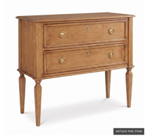 Load image into Gallery viewer, The Phillips Scott Franklin Chest pairs classic proportions with practical storage and a light, elevated silhouette. Crafted from hardwood solids and veneers, it features two spacious drawers framed by traditional molding. Brass hardware and decorative key escutcheons add warmth, while the molded top and tall tapered legs complete its timeless design. Good Bones Furniture
