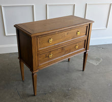 Load image into Gallery viewer, The Phillips Scott Franklin Chest pairs classic proportions with practical storage and a light, elevated silhouette. Crafted from hardwood solids and veneers, it features two spacious drawers framed by traditional molding. Brass hardware and decorative key escutcheons add warmth, while the molded top and tall tapered legs complete its timeless design. Good Bones Furniture
