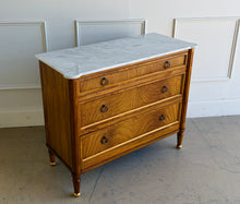 Load image into Gallery viewer, Elegant and effortlessly functional, the Riley Mahogany Chest pairs classic proportions with luxe details. A cerejeira (Brazilian oak) veneer creates a striking feathered grain across the drawer fronts, framed by subtle gold trim that’s echoed on the turned feet. Finished in a warm mahogany tone with mahogany or marble top and fitted with antique brass ring pulls, Riley brings tailored sophistication to bedrooms, entryways, or living spaces while offering generous, everyday storage. Good Bones Furniture
