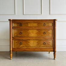 Load image into Gallery viewer, Elegant and effortlessly functional, the Riley Mahogany Chest pairs classic proportions with luxe details. A cerejeira (Brazilian oak) veneer creates a striking feathered grain across the drawer fronts, framed by subtle gold trim that’s echoed on the turned feet. Finished in a warm mahogany tone with mahogany or marble top and fitted with antique brass ring pulls, Riley brings tailored sophistication to bedrooms, entryways, or living spaces while offering generous, everyday storage. Good Bones Furniture
