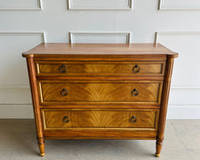 Load image into Gallery viewer, Elegant and effortlessly functional, the Riley Mahogany Chest pairs classic proportions with luxe details. A cerejeira (Brazilian oak) veneer creates a striking feathered grain across the drawer fronts, framed by subtle gold trim that’s echoed on the turned feet. Finished in a warm mahogany tone with mahogany or marble top and fitted with antique brass ring pulls, Riley brings tailored sophistication to bedrooms, entryways, or living spaces while offering generous, everyday storage. Good Bones Furniture
