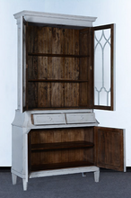 Load image into Gallery viewer, Elevate your dining or living space with the timeless elegance of the Rosalind China Cabinet. Handcrafted from solid mango wood and mango wood veneers, this cabinet combines durability with natural beauty, showcasing the wood's rich, warm tones and unique grain patterns. Its sleek design is complemented by solid brass hardware, adding a touch of refined sophistication. Good Bones Furniture
