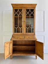 Load image into Gallery viewer, Elevate your dining or living space with the timeless elegance of the Rosalind China Cabinet. Handcrafted from solid mango wood and mango wood veneers, this cabinet combines durability with natural beauty, showcasing the wood's rich, warm tones and unique grain patterns. Its sleek design is complemented by solid brass hardware, adding a touch of refined sophistication. Good Bones Furniture
