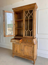 Load image into Gallery viewer, Elevate your dining or living space with the timeless elegance of the Rosalind China Cabinet. Handcrafted from solid mango wood and mango wood veneers, this cabinet combines durability with natural beauty, showcasing the wood's rich, warm tones and unique grain patterns. Its sleek design is complemented by solid brass hardware, adding a touch of refined sophistication. Good Bones Furniture
