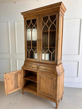 Load image into Gallery viewer, Elevate your dining or living space with the timeless elegance of the Rosalind China Cabinet. Handcrafted from solid mango wood and mango wood veneers, this cabinet combines durability with natural beauty, showcasing the wood's rich, warm tones and unique grain patterns. Its sleek design is complemented by solid brass hardware, adding a touch of refined sophistication. Good Bones Furniture
