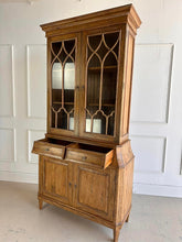 Load image into Gallery viewer, Elevate your dining or living space with the timeless elegance of the Rosalind China Cabinet. Handcrafted from solid mango wood and mango wood veneers, this cabinet combines durability with natural beauty, showcasing the wood's rich, warm tones and unique grain patterns. Its sleek design is complemented by solid brass hardware, adding a touch of refined sophistication. Good Bones Furniture
