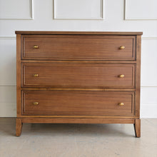 Load image into Gallery viewer, The Sherrill Occasional 3 Drawer Single Dresser offers clean transitional styling with refined materials and balanced proportions. Crafted from maple solids and quartered walnut veneers, this piece showcases subtle linear grain movement enhanced by the warm Cashew finish. Good Bones Furniture
