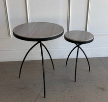 Load image into Gallery viewer, This pair of Studio|A accent tables blends sculptural ironwork with natural stone in a way that feels both organic and architectural. Featuring hand-worked forged iron bases with airy tripod silhouettes, the tables have a visually light presence despite the substantial stone tops. Good Bones Furniture
