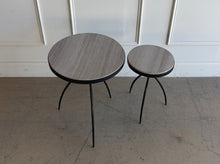 Load image into Gallery viewer, This pair of Studio|A accent tables blends sculptural ironwork with natural stone in a way that feels both organic and architectural. Featuring hand-worked forged iron bases with airy tripod silhouettes, the tables have a visually light presence despite the substantial stone tops. Good Bones Furniture

