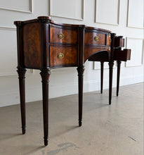 Load image into Gallery viewer, Angled right view of the Theodore Alexander Stanhope Row Sideboard with the right drawers open, showcasing fine interior construction, flame mahogany veneer, arched apron, and traditional brass hardware at Good Bones Furniture, Raleigh, North Carolina.
